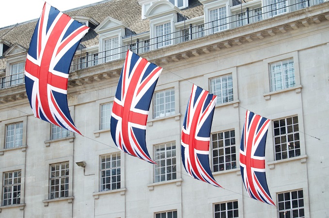 4 flags of UK hanging on building